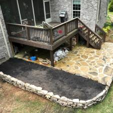 Natural-stone-retaining-wall-and-Flagstone-patio 1